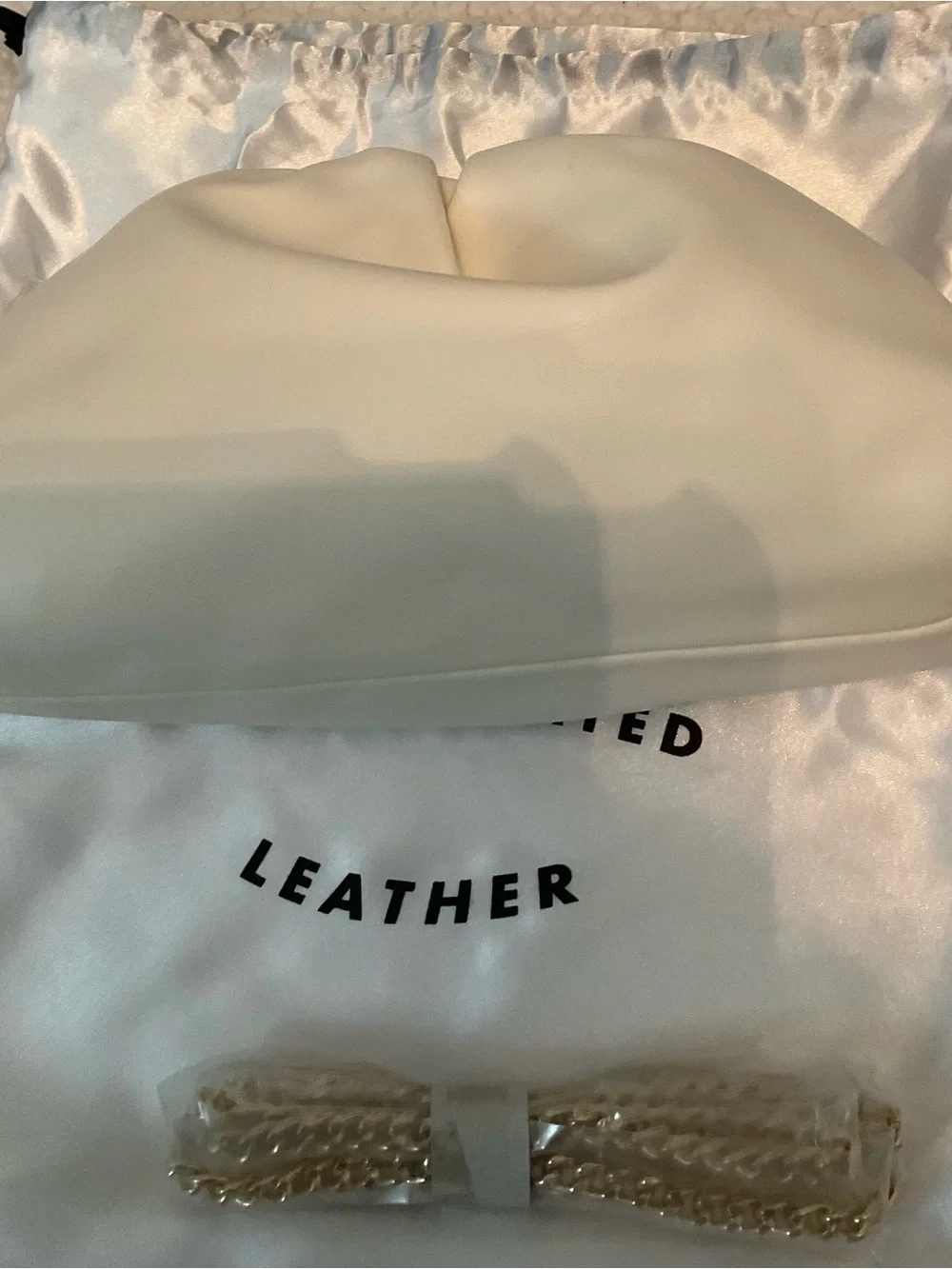 Understated Leather crescent cream